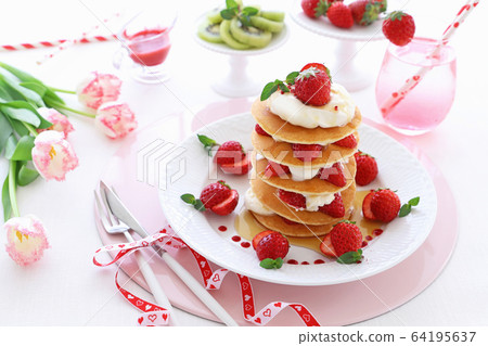 Strawberry pancakes with maple syrup 64195637