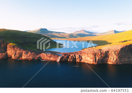 Sorvagsvatn lake on cliffs of Vagar island in sunset, Faroe Islands Sorvagsvatn lake on cliffs of Vagar island in sunset, Faroe Islands 64197551