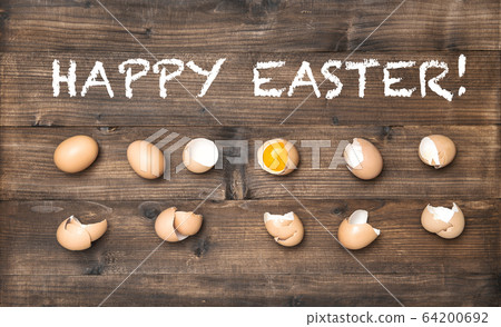 Happy Easter Raw eggs wooden background Happy Easter Raw eggs wooden background 64200692