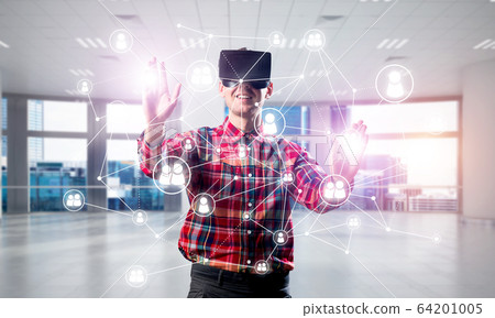 Guy wearing checked shirt and virtual mask reaching hand to touch screen 64201005