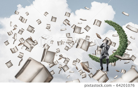 Young man in sky do not want to see anything and books flying ar Young man in sky do not want to see anything and books flying ar 64201076