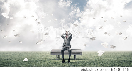 Young man in suit in park dont want to hear anything 64201146