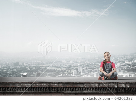 Concept of careless happy childhood with girl of school age smil Concept of careless happy childhood with girl of school age smil 64201382