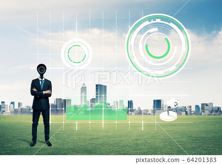 Camera headed man standing on green grass against modern citysca 64201383
