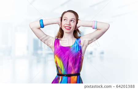 Redhead beautiful girl closing her ears with hands 64201388