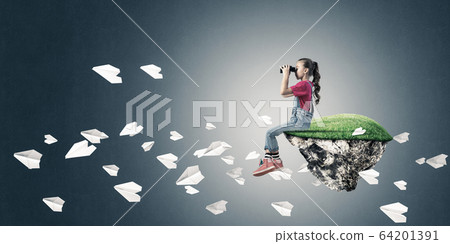 Concept of careless happy childhood with girl looking in binocul Concept of careless happy childhood with girl looking in binocul 64201391