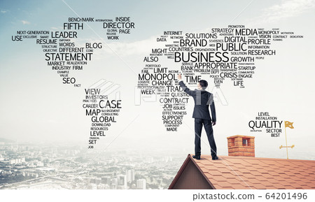 Businessman on brick roof draw world map as concept of globaliza Businessman on brick roof draw world map as concept of globaliza 64201496