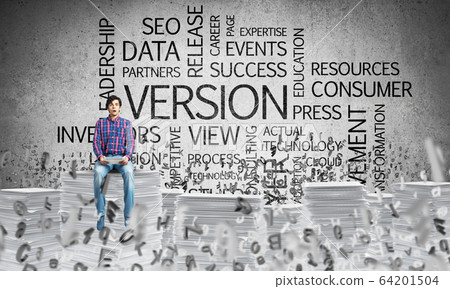 Attractive man sitting on pile of paper documents. Attractive man sitting on pile of paper documents. 64201504