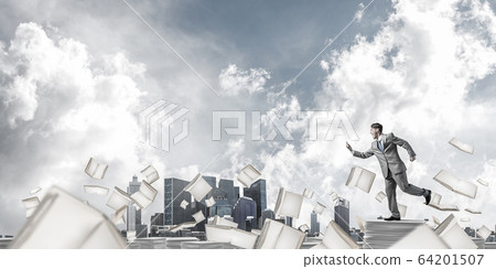 Precise businessman in suit running with phone. 64201507