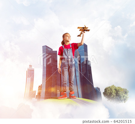 Concept of careless happy childhood with girl dreaming to become pilot Concept of careless happy childhood with girl dreaming to become pilot 64201515