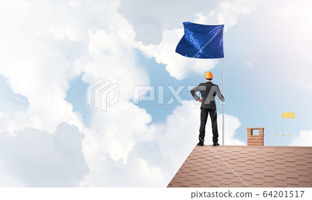 Young businessman with flag presenting concept of leadership. Mixed media Young businessman with flag presenting concept of leadership. Mixed media 64201517