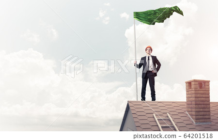 Young businessman with flag presenting concept of leadership. Mi Young businessman with flag presenting concept of leadership. Mi 64201518