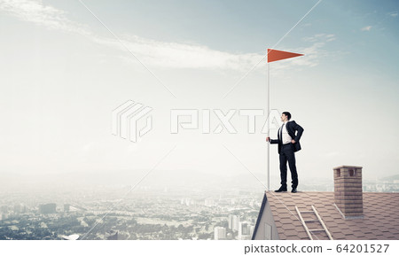 Young businessman with flag presenting concept of leadership. Mi Young businessman with flag presenting concept of leadership. Mi 64201527
