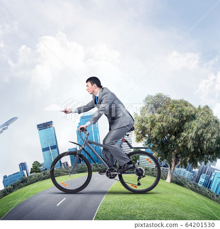 Businessman with paper documents in hand Businessman with paper documents in hand 64201530