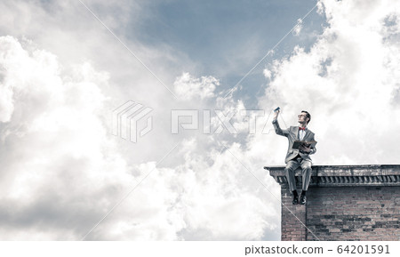 Young businessman or student studying the science on building ro Young businessman or student studying the science on building ro 64201591