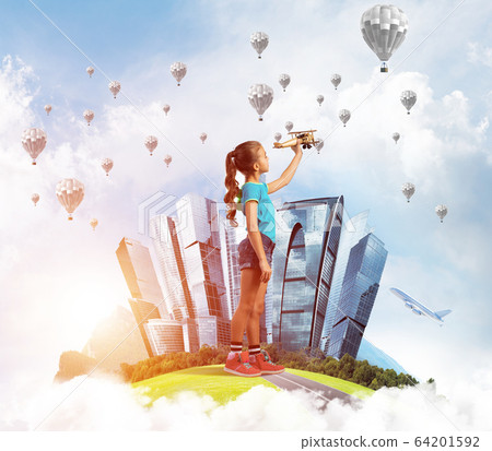 Concept of careless happy childhood with girl dreaming to become pilot Concept of careless happy childhood with girl dreaming to become pilot 64201592