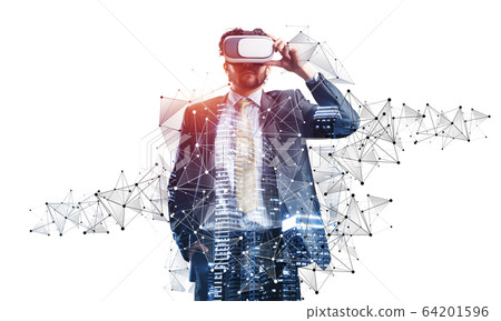 Handsome young man standing with VR headset Handsome young man standing with VR headset 64201596