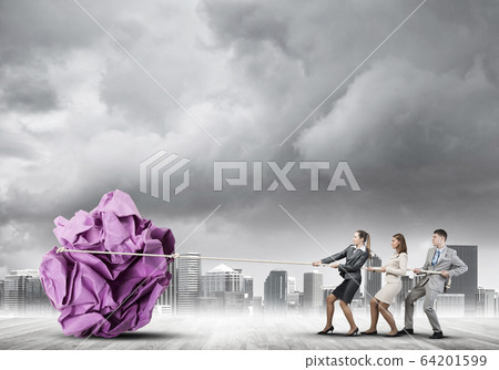 Young business people outdoors and huge paper ball as symbol of creativity 64201599