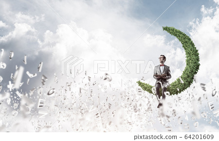 Young businessman or student studying the science and symbols fl 64201609