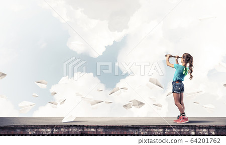 Concept of careless happy childhood with girl exploring this wor 64201762