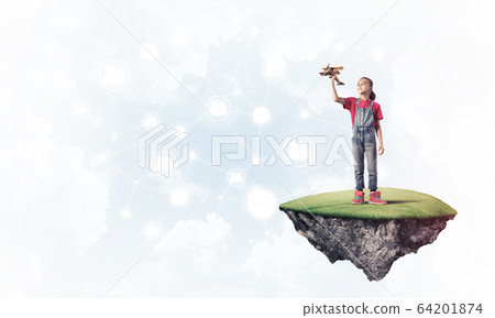 Concept of careless happy childhood with girl dreaming about som Concept of careless happy childhood with girl dreaming about som 64201874