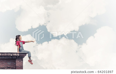 Concept of careless happy childhood with girl showing touch gest Concept of careless happy childhood with girl showing touch gest 64201897