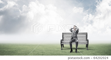 Young man in suit in park dont want to hear anything Young man in suit in park dont want to hear anything 64202024