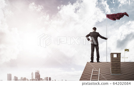 Young businessman with flag presenting concept of leadership. Mi 64202084