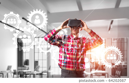 Guy wearing checked shirt and virtual mask demonstrating some emotions Guy wearing checked shirt and virtual mask demonstrating some emotions 64202087