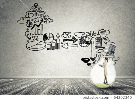 Businesswoman trapped in bulb Businesswoman trapped in bulb 64202340