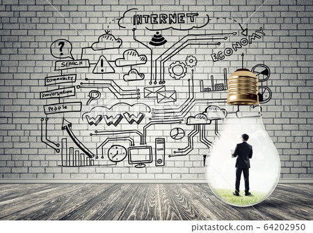 Businessman trapped in bulb Businessman trapped in bulb 64202950