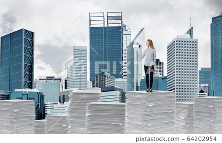 Woman keeping megaphone in hand. Woman keeping megaphone in hand. 64202954