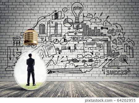 Businessman trapped in bulb Businessman trapped in bulb 64202955