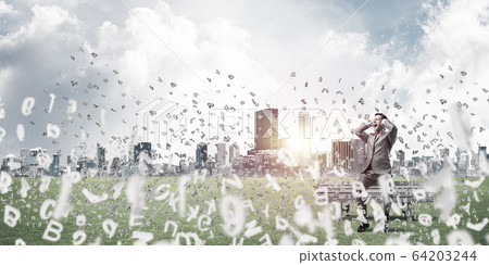 Young man on bench in summer park cant hear the sound 64203244