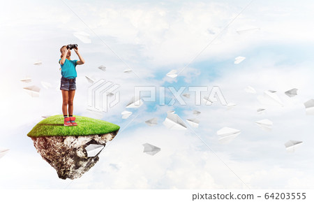 Concept of careless happy childhood with girl looking in binoculars Concept of careless happy childhood with girl looking in binoculars 64203555