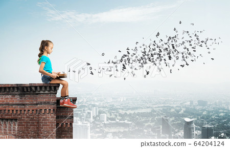 Concept of careless happy childhood with girl exploring this world 64204124