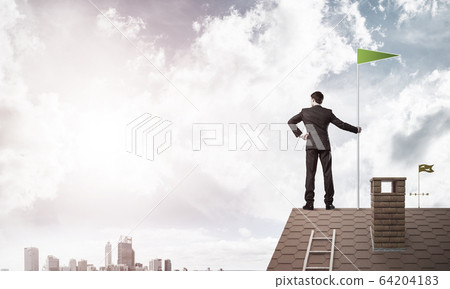 Young businessman with flag presenting concept of leadership. Mi Young businessman with flag presenting concept of leadership. Mi 64204183