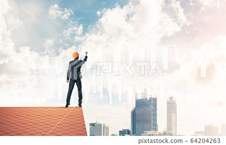 Man architect draw silhouette of modern city on blue sky. Mixed Man architect draw silhouette of modern city on blue sky. Mixed 64204263