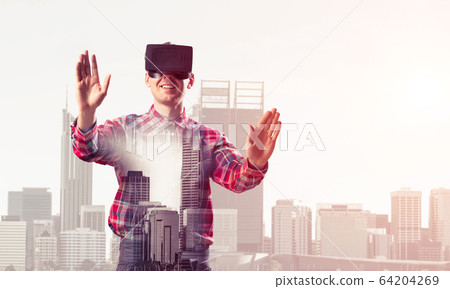 Guy wearing checked shirt and virtual mask stretching hands and Guy wearing checked shirt and virtual mask stretching hands and 64204269