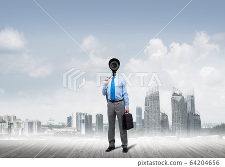 Camera headed man standing on wooden floor against modern cityscape Camera headed man standing on wooden floor against modern cityscape 64204656