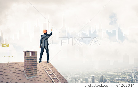 Man architect draw silhouette of modern city on blue sky. Mixed Man architect draw silhouette of modern city on blue sky. Mixed 64205014