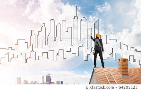 Man architect draw silhouette of modern city on blue sky. Mixed media Man architect draw silhouette of modern city on blue sky. Mixed media 64205123