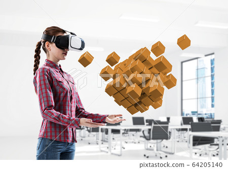 Girl in virtual reality mask experiencing virtual technology world. Mixed media 64205140