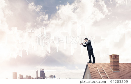 Engineer man standing on roof and looking in spyglass. Mixed med Engineer man standing on roof and looking in spyglass. Mixed med 64205209