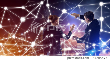 Concept of social connection and networking against night city view and partners working in cooperation 64205473