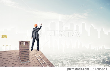 Man architect draw silhouette of modern city on blue sky. Mixed Man architect draw silhouette of modern city on blue sky. Mixed 64205841