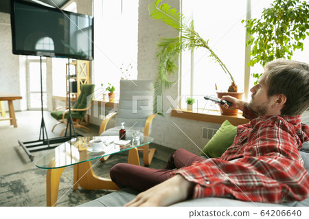 Caucasian man staying at home during quarantine because of coronavirus spreading 64206640