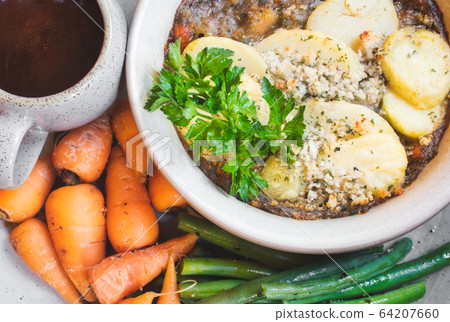 Traditional recipe hot pot with gravy and potatoes Traditional recipe hot pot with gravy and potatoes 64207660