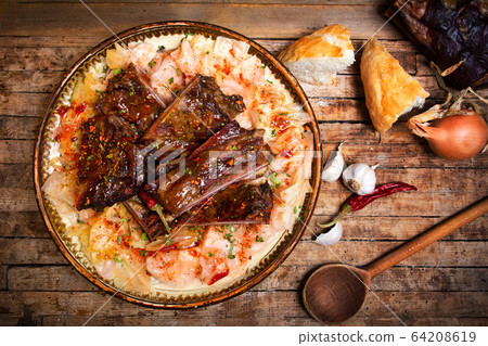 Dish of cabbage and smoked meat in rustic bowl 64208619