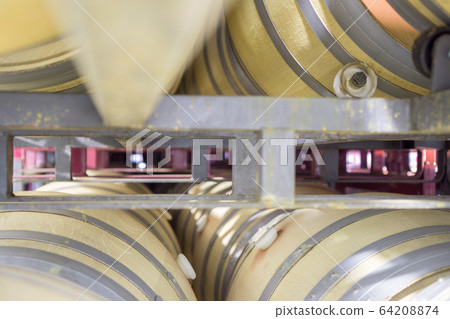 Perspectivew view of wine cellar with wooden barrels Perspectivew view of wine cellar with wooden barrels 64208874